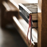 closeup_of_pew_and_hymnbooks3.jpg_smaller_version3